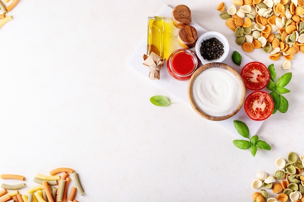 Raw ingredients for cooking Italian penne pasta