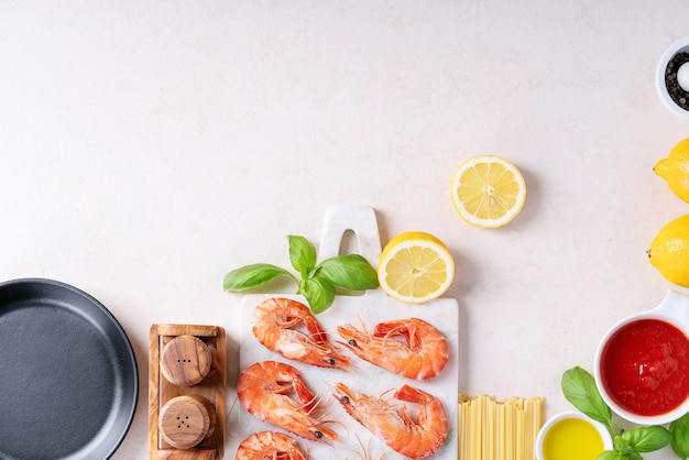 Raw ingredients for cooking: Shrimp prawns Italian spaghetti pasta