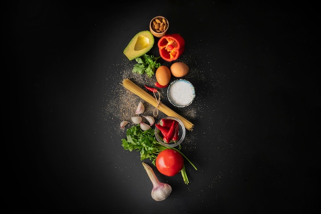 Raw ingredients for cooking spaghetti marinara with poached eggs flat lay and copy spaces