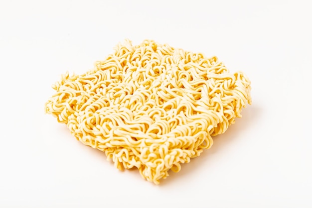 Raw instant noodles on white background