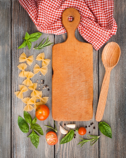 Raw Italian pasta with tomato sauce ingredients