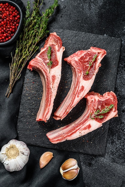 Raw lamb chops Rack of Lamb with rosemary and spices