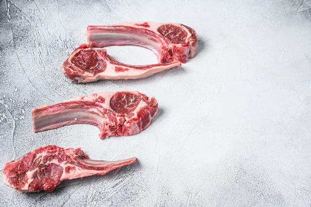 Raw lamb meat chops on a butcher table