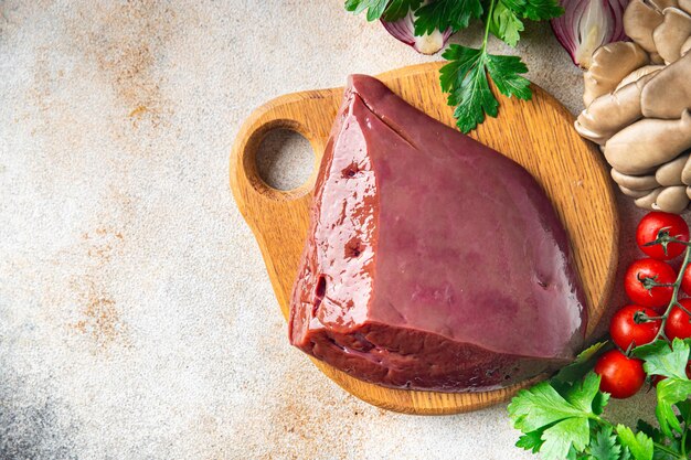 Raw liver beef or pork healthy meal food diet snack on the table copy space food background rustic