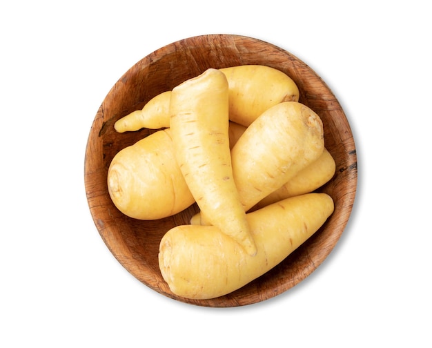 Raw mandioquinha or arracacha in a bowl isolated over white background