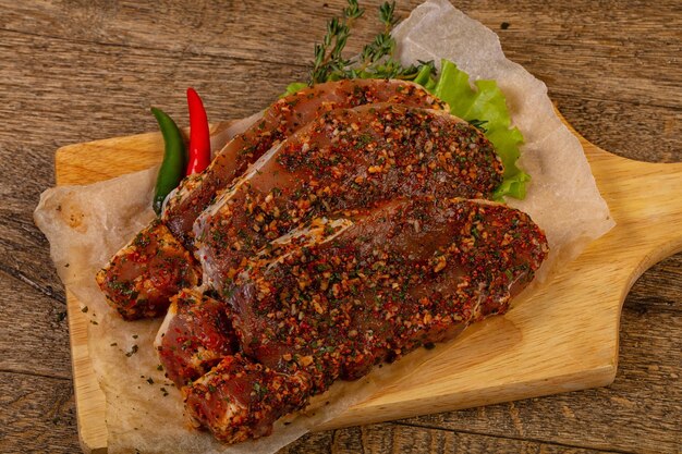 Raw marinated pork steak