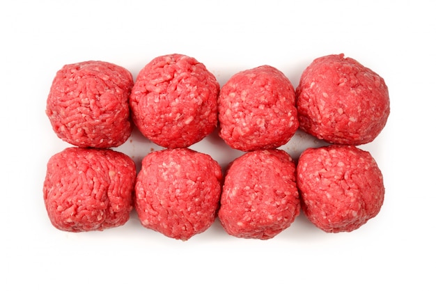 Raw meat balls isolated on white background.