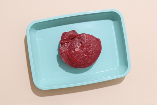 Raw meat on color background