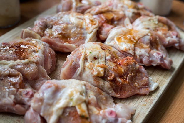 Raw meat in marinade waiting to be fried