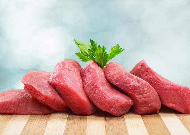 Raw Meat slices on light background