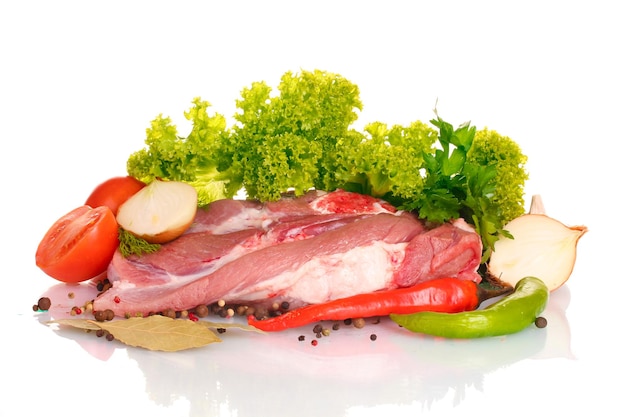 Raw meat and vegetables isolated on white