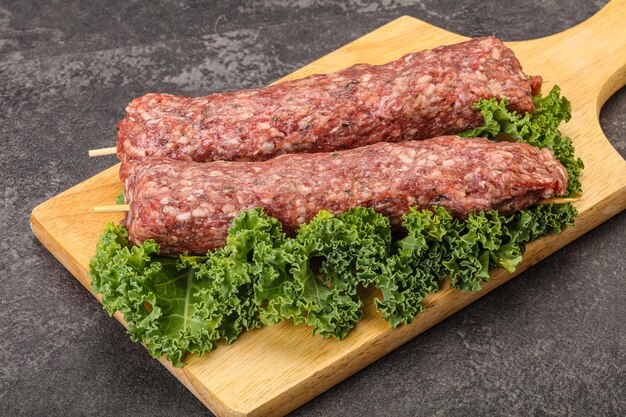 Raw minced beef kebab skewer