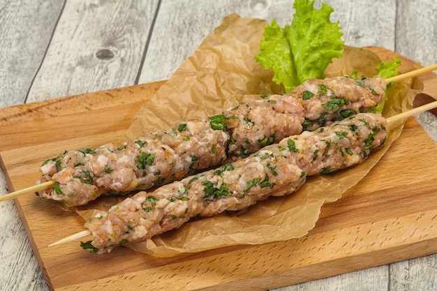 Raw minced pork skewer kebab for grill