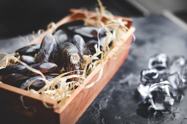 Raw mussels for cooking in a basket