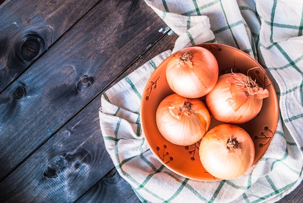 Raw onion in a ceramic bowl