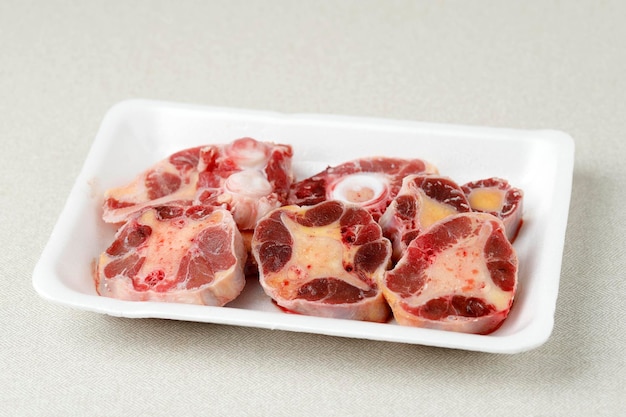 Raw Oxtail on Styrofoam Plate