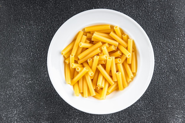 raw pasta penne tortiglioni cooking appetizer meal food snack on the table copy space food