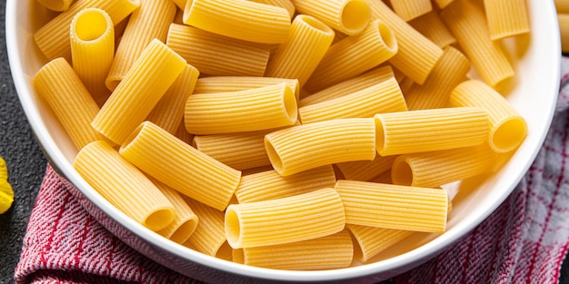 raw pasta rigatoni ingredients meal food snack on the table copy space food background rustic top