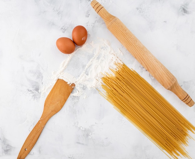 Raw pasta with flour