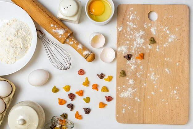 Raw pasta with ingredients on the white table Top view Different kinds of pasta Various types of pasta Italian cuisine Free space for text Pasta background Flour and eggs