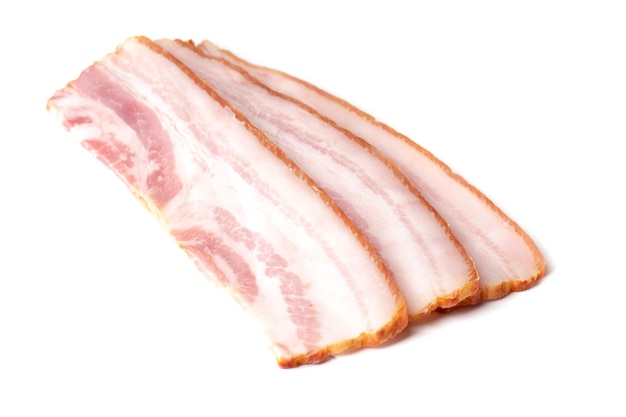 Raw pieces of fresh bacon isolated on a white background