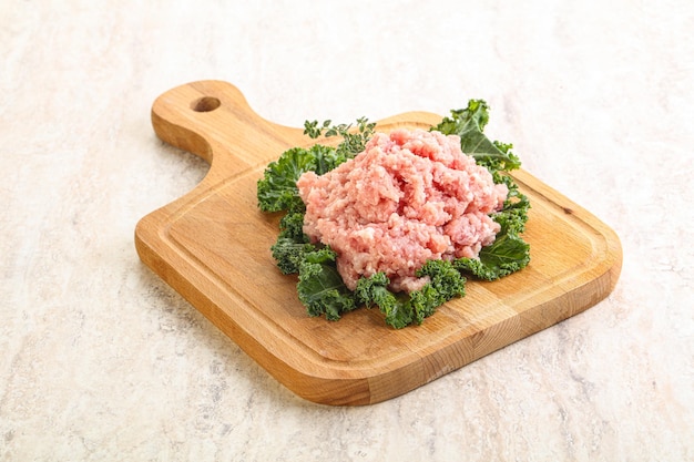 Raw pork homemade minced meat for cooking over board