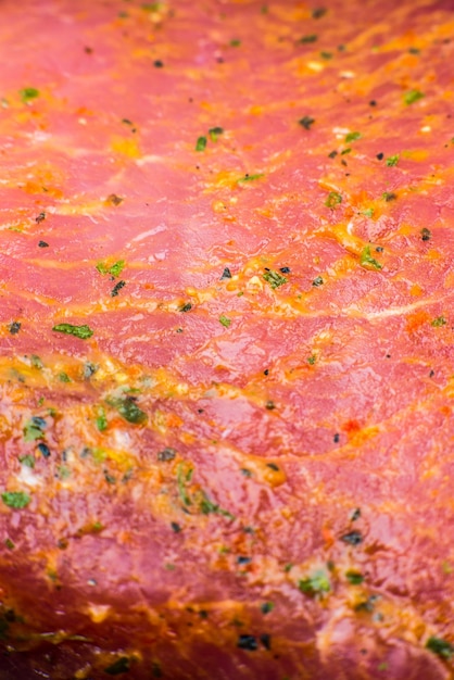 Raw Pork meat with spices and herbs Red meat texture background Macro photo Fat Fresh juicy steak