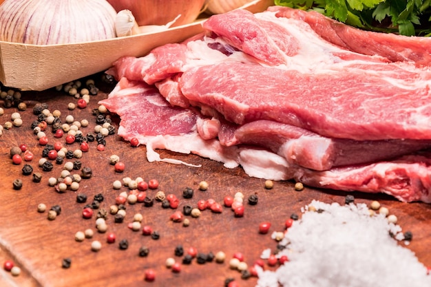 Raw pork ribs in the loin on a wooden board