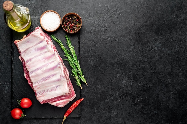 raw pork ribs on a stone background