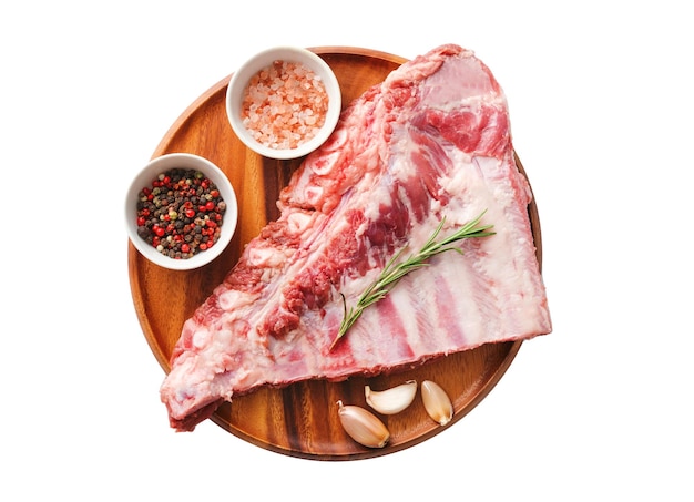 Raw pork ribs on white background with spices and rosemary Fresh pork Spareribs