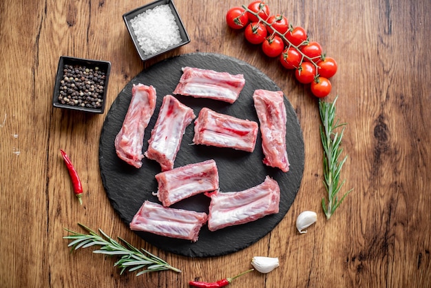 raw pork ribs on wooden background