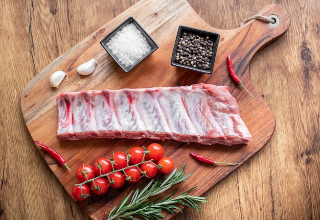 raw pork ribs on wooden background