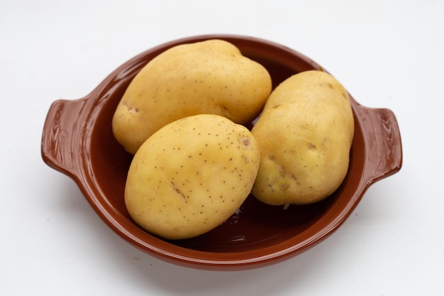 Raw potatoes isolated on white background