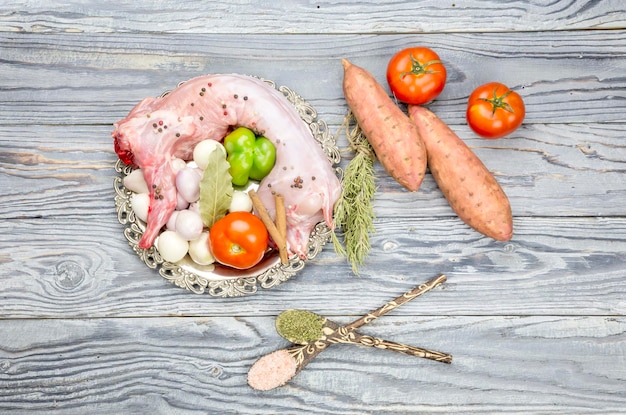 Raw rabbit on a wooden background