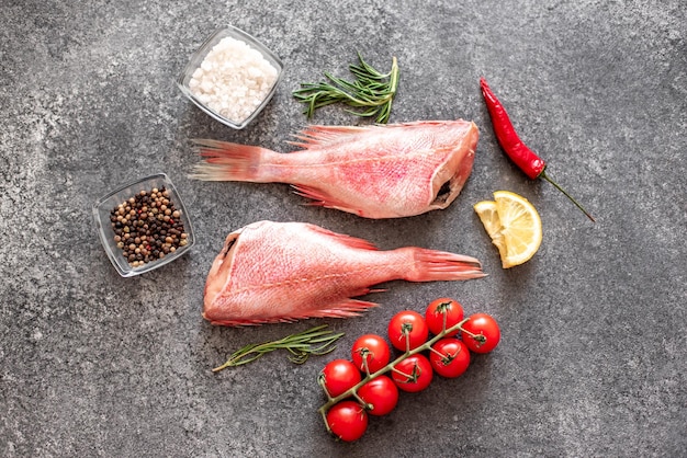 raw red sea bass on stone background