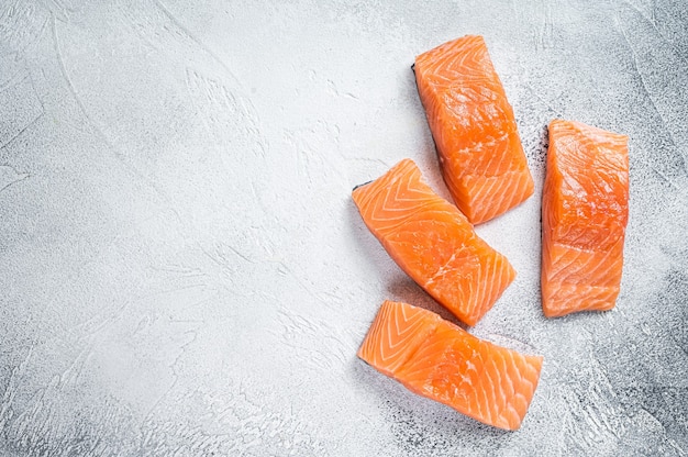 Raw salmon fillet steak on kitchen table