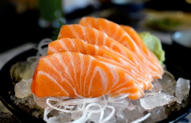 Raw salmon slice or salmon sashimi.