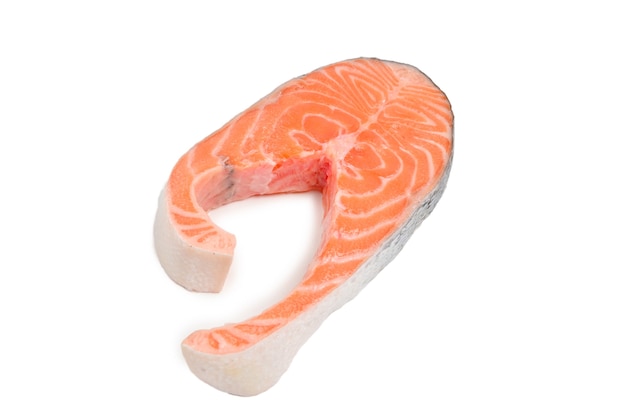 Raw salmon steak isolated on white.