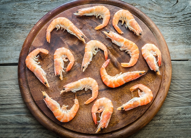 Raw shrimps on the wooden board