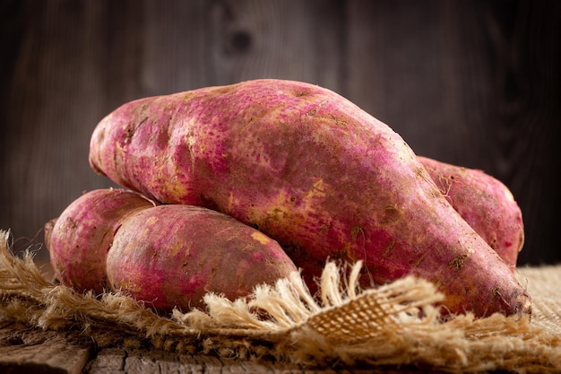 Raw sweet potato on the table