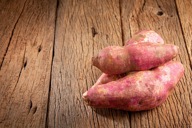 Raw sweet potato on the table