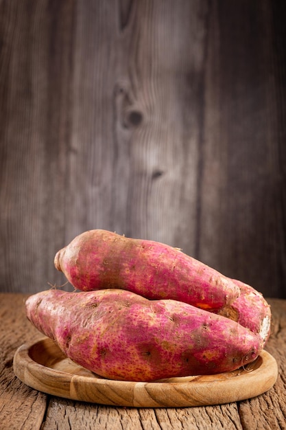 Raw sweet potato on the table