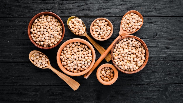 Raw Turkish Pea Nut On a black background Top view Free copy space