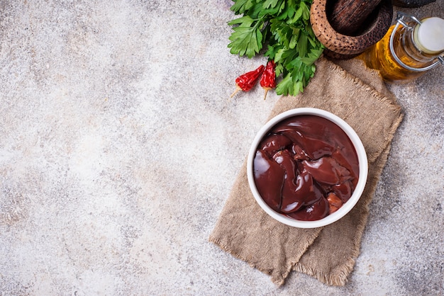 Raw uncooked  liver and spices for cooking 