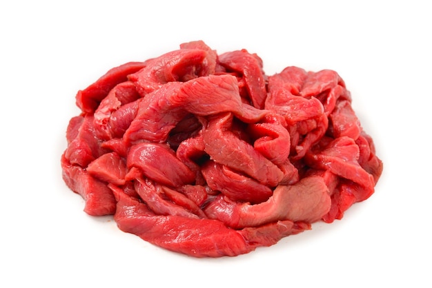 Raw veal pieces background.  Beef stroganoff.