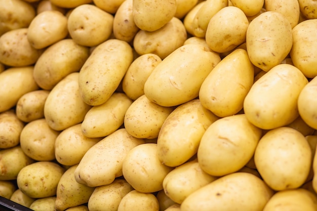 Raw vegetable potatoes food on the market for pattern texture and background.