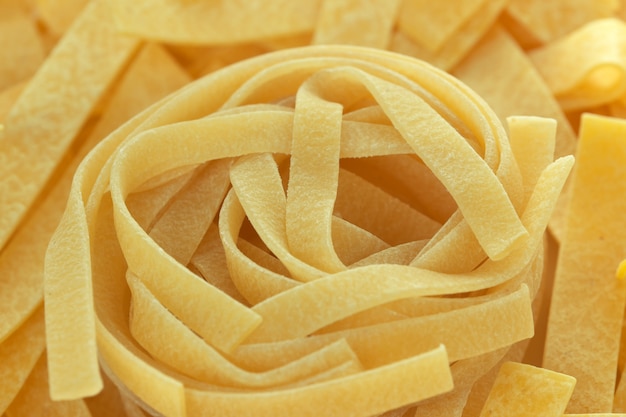 Raw wheat pasta close up