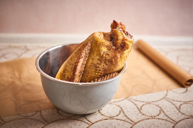 Raw wild mallard duck in bowl ready to be cooked Game or quarry birds whole duck preparing for roast