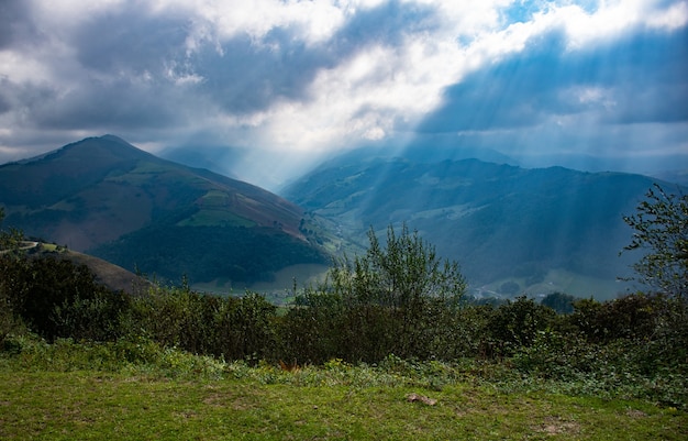 Rays of light reflecting on a town on the Pasiegos valleys in Cantabria (Spain)