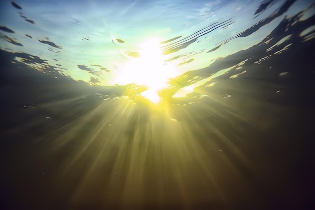 rays of light underwater fresh lake, abstract background nature landscape sun water